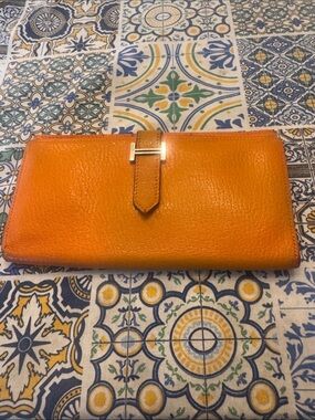 Hermes’ Bearn Long Wallet Orange Grained Leather Palladium H